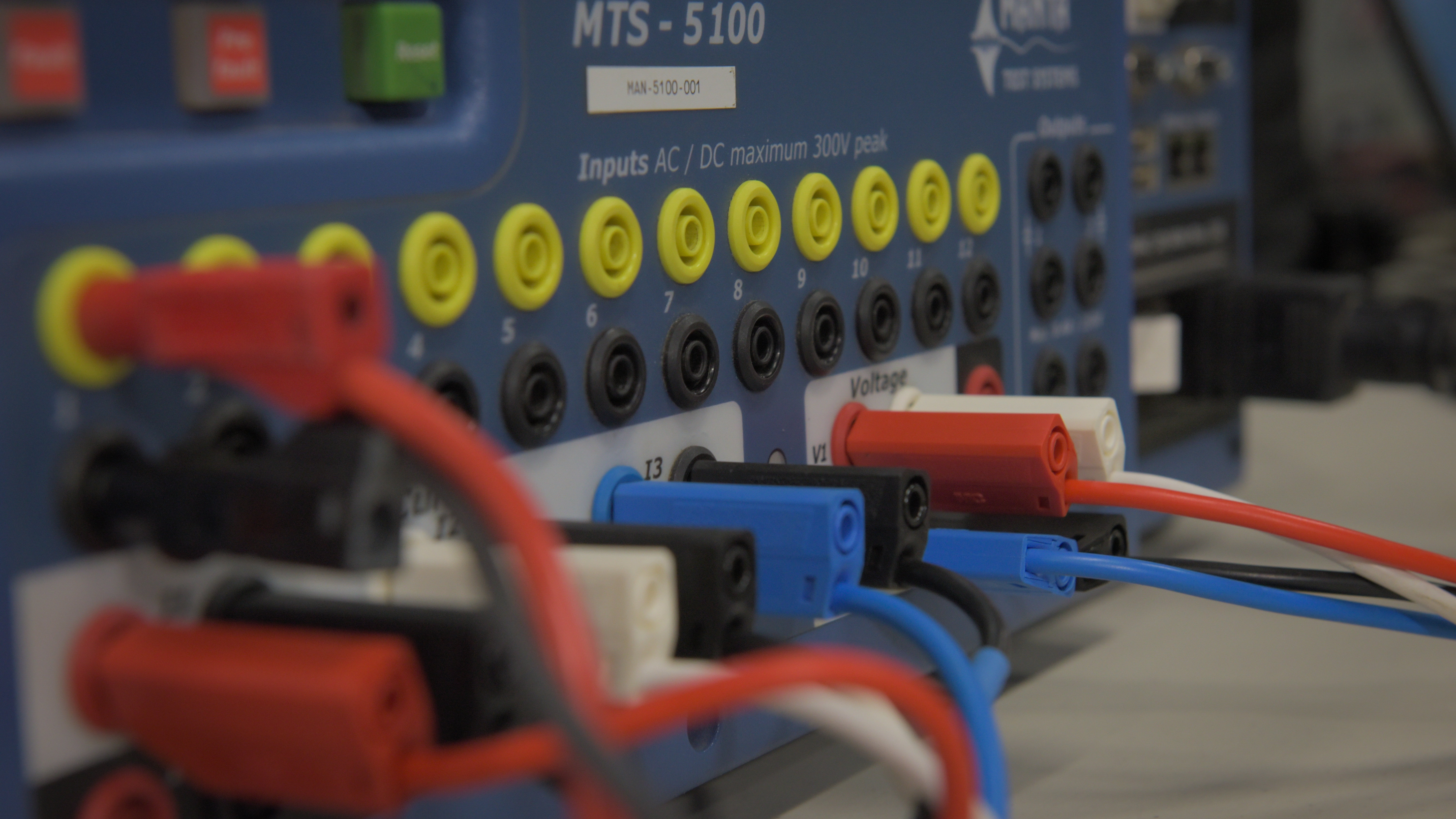 wires plugged into the back of dynamo diagnostic instrumentation.